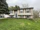 Charming two-story home featuring a well-manicured lawn, traditional siding, and inviting front door at 6225 Roberts Creek Ln, Indianapolis, IN 46221