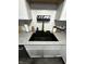 Close-up of kitchen sink with granite countertops and a black modern faucet at 6225 Roberts Creek Ln, Indianapolis, IN 46221
