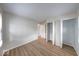 Bright bedroom featuring new laminate flooring, a closet, and a window allowing natural light at 6501 Meadowlark Dr, Indianapolis, IN 46226