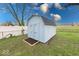 Light blue shed in backyard offering ample outdoor storage solutions at 6501 Meadowlark Dr, Indianapolis, IN 46226