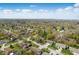 An aerial view shows the neighborhood with mature trees and well-maintained lawns at 6742 S New Jersey St, Indianapolis, IN 46227