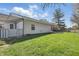 A well-maintained backyard featuring lush green grass, a fence, and a pergola at 6742 S New Jersey St, Indianapolis, IN 46227