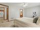Bedroom featuring carpeted floors and access to the bathroom and other parts of the house at 6742 S New Jersey St, Indianapolis, IN 46227
