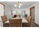 Dining area with woven chairs, stylish lighting, and open access to other living spaces at 6742 S New Jersey St, Indianapolis, IN 46227
