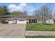 Charming single-story townhome with a one-car garage and well-manicured front lawn at 6742 S New Jersey St, Indianapolis, IN 46227