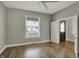 Bedroom with refinished hardwood floors and a bright window at 715 Cottage Ave, Indianapolis, IN 46203