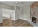 Bedroom with refinished hardwood floors and exposed brick fireplace at 715 Cottage Ave, Indianapolis, IN 46203