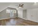 Bright bedroom showcasing hardwood floors, large windows, and ample closet space at 715 Cottage Ave, Indianapolis, IN 46203