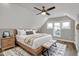 Bright bedroom featuring natural light, ceiling fan, and a stylish decorative rug at 715 Cottage Ave, Indianapolis, IN 46203