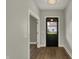 Entryway featuring new flooring, fresh paint, and updated lighting, creating a welcoming atmosphere at 715 Cottage Ave, Indianapolis, IN 46203