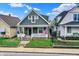 Charming home with well-manicured front lawn and welcoming porch at 715 Cottage Ave, Indianapolis, IN 46203