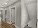Upstairs hallway with wood-look floors and access to bedrooms and bathrooms at 715 Cottage Ave, Indianapolis, IN 46203