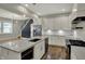 Open concept kitchen featuring a kitchen island with quartz countertops and stainless steel appliances at 715 Cottage Ave, Indianapolis, IN 46203