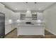 Modern kitchen with white cabinets, stainless steel appliances, and a central island at 715 Cottage Ave, Indianapolis, IN 46203