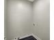 The empty laundry room is ready for a washer and dryer hookups at 715 Cottage Ave, Indianapolis, IN 46203