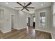 Open-concept living space featuring hardwood floors, ample natural light, and modern finishes at 715 Cottage Ave, Indianapolis, IN 46203