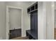 Mudroom featuring a dark built-in storage with bench and hooks at 715 Cottage Ave, Indianapolis, IN 46203