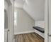 Upstairs office space with built-in desk, shiplap accents, and wood-look floors at 715 Cottage Ave, Indianapolis, IN 46203