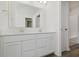 Bright bathroom featuring double vanity with quartz countertop and doorway to a shower at 7342 Shroyer Way, Noblesville, IN 46062