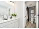 Well-lit bathroom features double vanity, sleek fixtures, and adjacent toilet and shower area at 7342 Shroyer Way, Noblesville, IN 46062