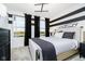 Spacious bedroom with stylish black and white design, natural light, and modern furniture at 7342 Shroyer Way, Noblesville, IN 46062