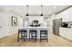 Spacious kitchen featuring a large island, stainless steel appliances, and modern pendant lighting at 7342 Shroyer Way, Noblesville, IN 46062