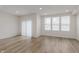 Bright living room with windows and a sliding glass door to provide natural light at 7342 Shroyer Way, Noblesville, IN 46062