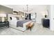 Spacious main bedroom with a cozy sitting area, decorative pillows, and modern lighting fixtures at 7342 Shroyer Way, Noblesville, IN 46062