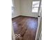 Bright bedroom features hardwood floors and natural light from two large windows at 737 S Broadway St, Pendleton, IN 46064