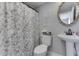 Bathroom featuring a pedestal sink, floral shower curtain, and decorative wall art at 7668 Heather Dr, Nineveh, IN 46164