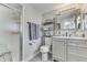 Bathroom with a glass door shower, vanity with storage, and decorative shelving and mirror at 7668 Heather Dr, Nineveh, IN 46164