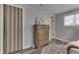 Bedroom featuring wood dresser, closet, and natural light at 7668 Heather Dr, Nineveh, IN 46164