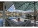 Covered deck with comfortable seating and a picturesque lake view at 7668 Heather Dr, Nineveh, IN 46164