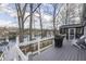 Relaxing deck area with a grill, seating, and stunning lake views at 7668 Heather Dr, Nineveh, IN 46164