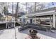 Inviting outdoor deck featuring a fire pit and cozy seating arrangement, perfect for relaxation and entertaining at 7668 Heather Dr, Nineveh, IN 46164