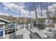 Inviting waterfront deck with lounge chairs, table, and picturesque lake view at 7668 Heather Dr, Nineveh, IN 46164