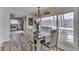 Open-concept dining area featuring a lake view, seating for six, and seamless flow to the adjacent kitchen and living room at 7668 Heather Dr, Nineveh, IN 46164