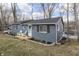 Charming home with blue siding, inviting front porch, and landscaping at 7668 Heather Dr, Nineveh, IN 46164