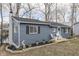 Quaint home featuring blue horizontal siding and stone landscaping details at 7668 Heather Dr, Nineveh, IN 46164