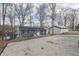 Exterior view of a cozy home with a well-kept yard and lake in the background at 7668 Heather Dr, Nineveh, IN 46164