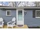Inviting front entrance with stylish decor and a glass paneled door with black shutters at 7668 Heather Dr, Nineveh, IN 46164
