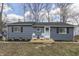 Charming single-story home with blue siding and a cozy front porch with seating at 7668 Heather Dr, Nineveh, IN 46164