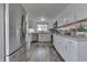 Bright kitchen featuring white cabinets, stainless steel appliances, and concrete countertops at 7668 Heather Dr, Nineveh, IN 46164