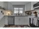 Close up on the kitchen with stainless steel appliances and white cabinets at 7668 Heather Dr, Nineveh, IN 46164