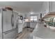 Well-lit kitchen with stainless steel appliances, white cabinetry, and ample counter space, perfect for cooking and entertaining at 7668 Heather Dr, Nineveh, IN 46164