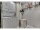 Laundry area with a stacked washer and dryer and plenty of storage space at 7668 Heather Dr, Nineveh, IN 46164
