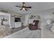 Inviting living room featuring a ceiling fan, comfortable armchair and couch, and stylish decor, perfect for relaxation and socializing at 7668 Heather Dr, Nineveh, IN 46164
