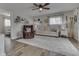 Cozy living room featuring neutral tones, a ceiling fan, comfortable seating, and stylish decor, creating a relaxing atmosphere at 7668 Heather Dr, Nineveh, IN 46164