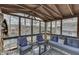 Screened in porch area featuring water views and comfortable seating at 7668 Heather Dr, Nineveh, IN 46164