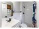 Bright, modern bathroom features a white vanity, tile floors, and a tiled shower at 7811 Hoover Rd, Indianapolis, IN 46260